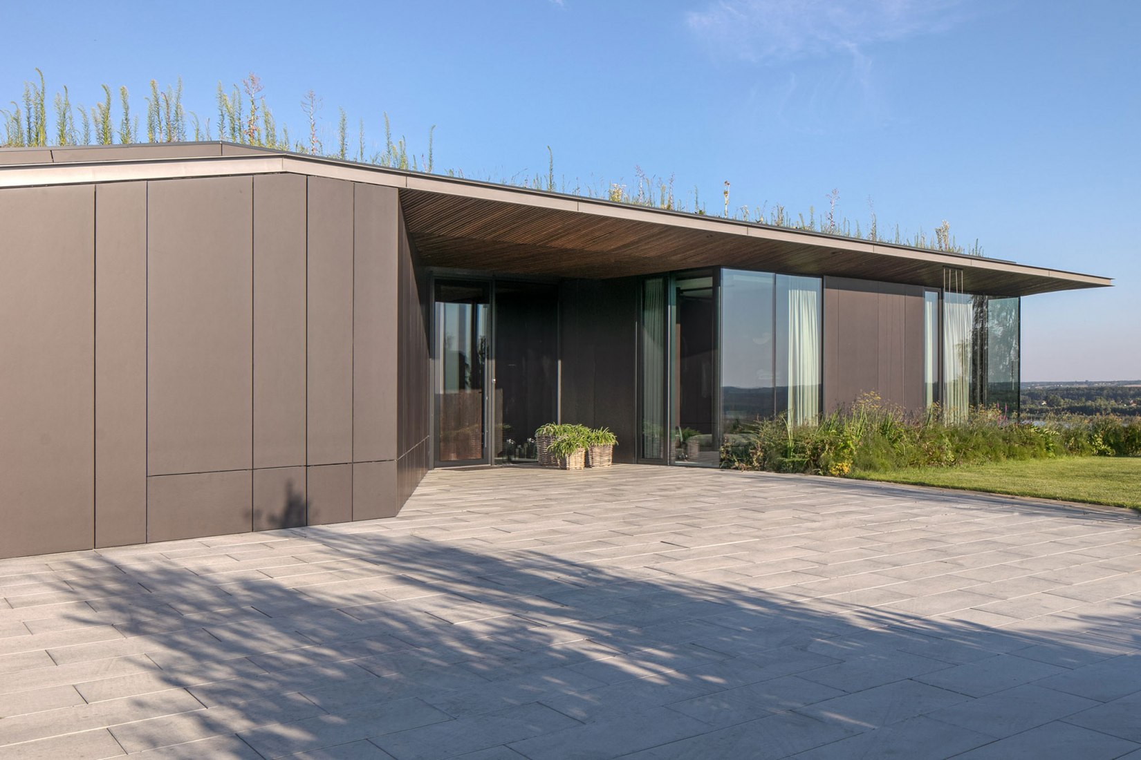 Casa pendiente 35:35 por 77 Studio Architektury. Fotografía por Piotr Krajewski.
