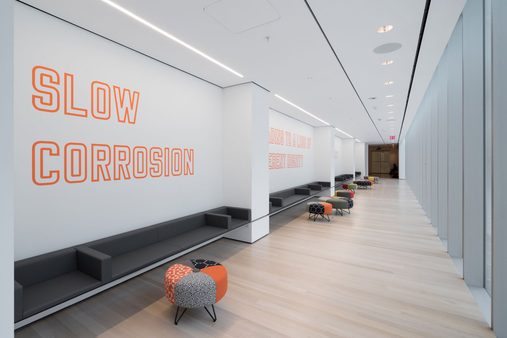View of The Louise Reinhardt Smith Gallery, including Lawrence Weiner’s slow corrosion leading to a loss of inherent dignity of the object at hand (1985). Photography © Iwan Baan