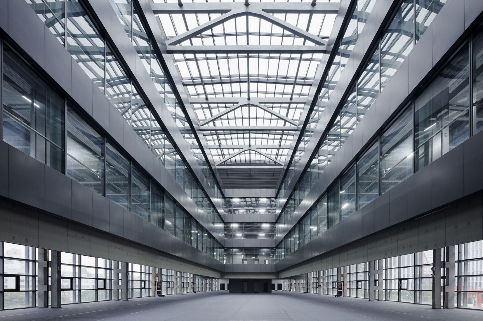 Atrium. Caohejing Xinzhou Plaza by GMP. Photograph by Hans-Georg Esch