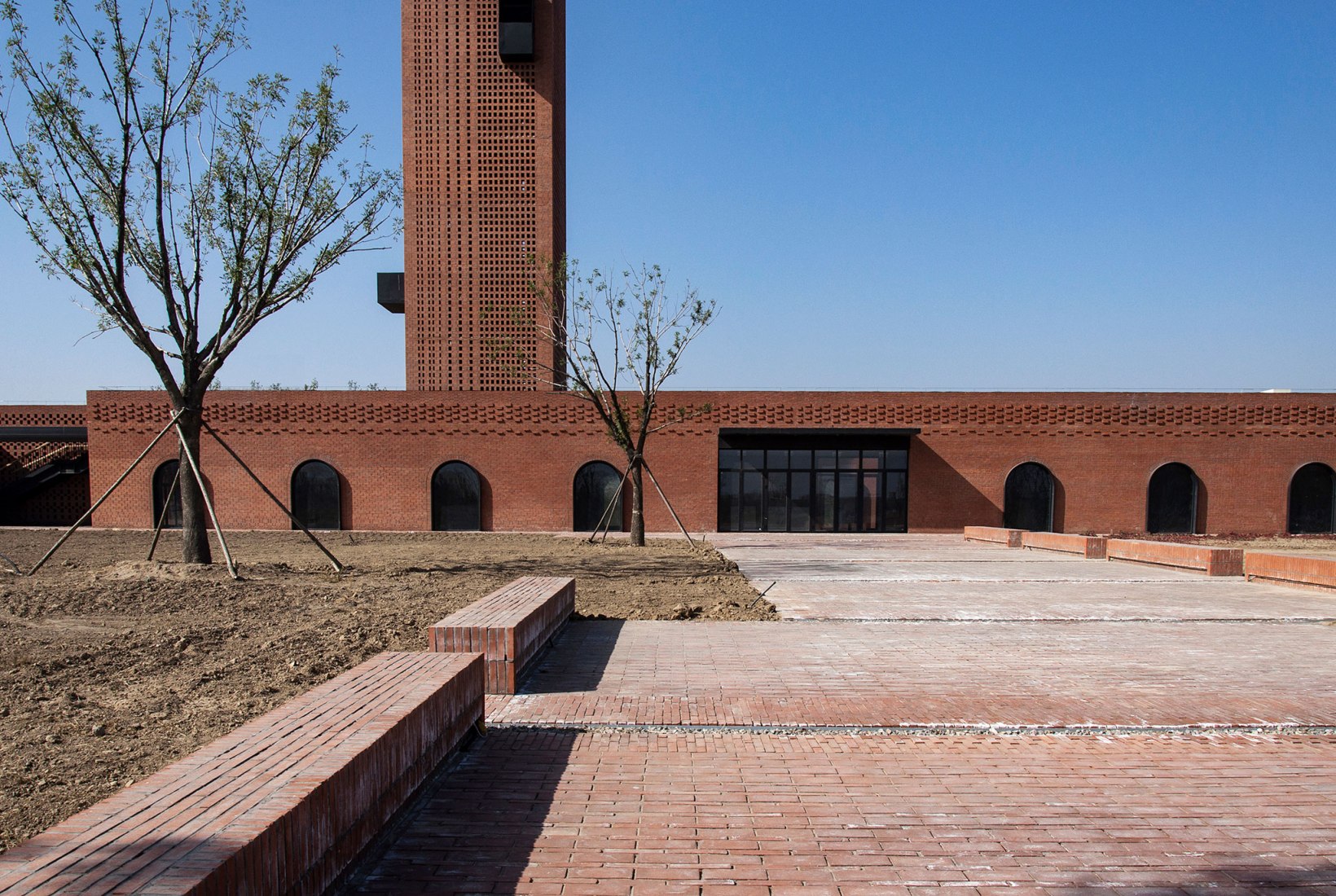 Main entrance plaza. Tower of Bricks by Interval Architects. Photograph by Zhi Geng