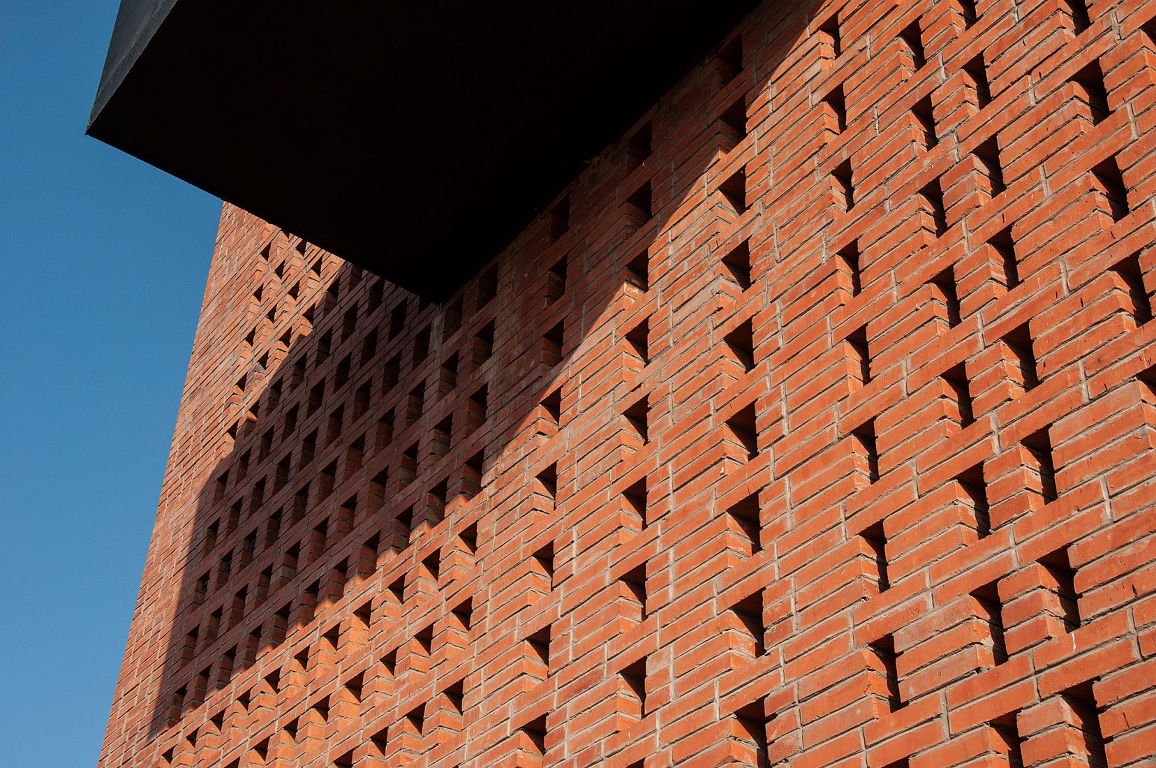 Detail of brick facade. Tower of Bricks by Interval Architects. Photograph by Zhi Geng