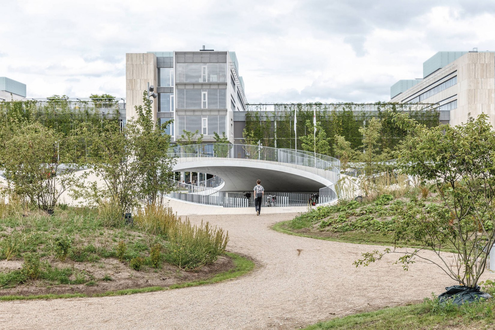 Bicycle parking under the hills. Karen Blixens Plads by COBE The