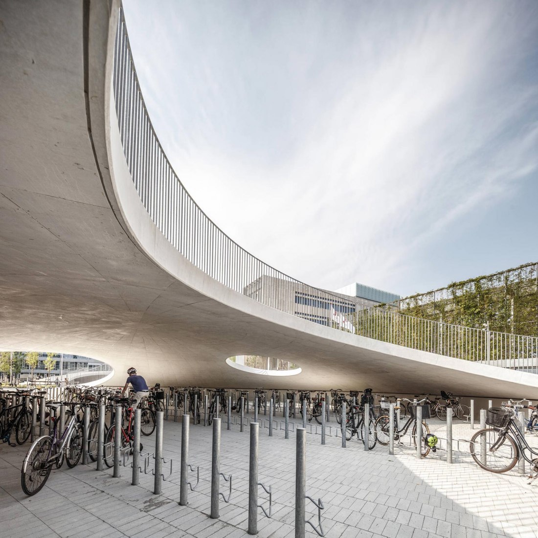 Bicycle parking under the hills. Karen Blixens Plads by COBE The