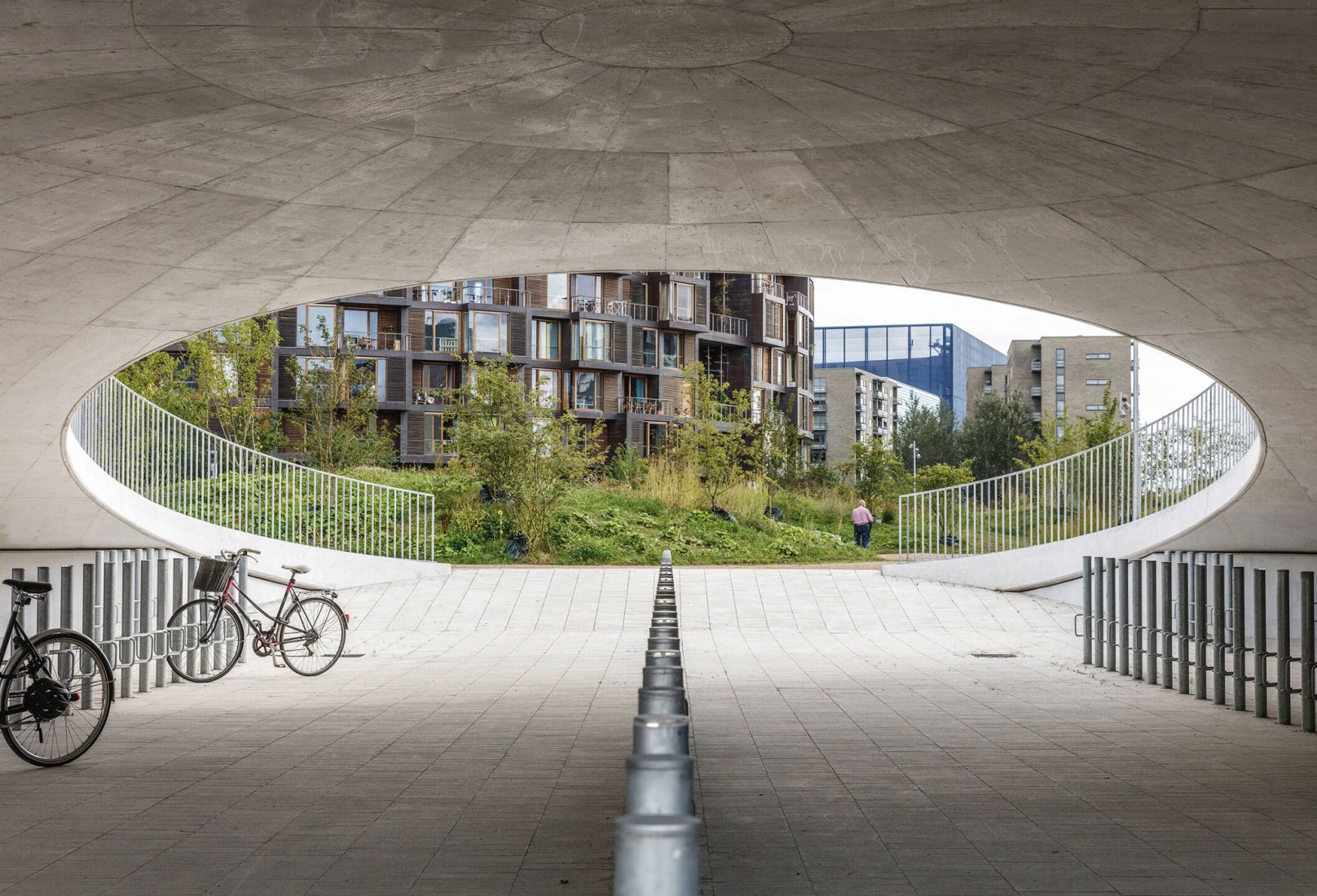 Bicycle parking under the hills. Karen Blixens Plads by COBE The