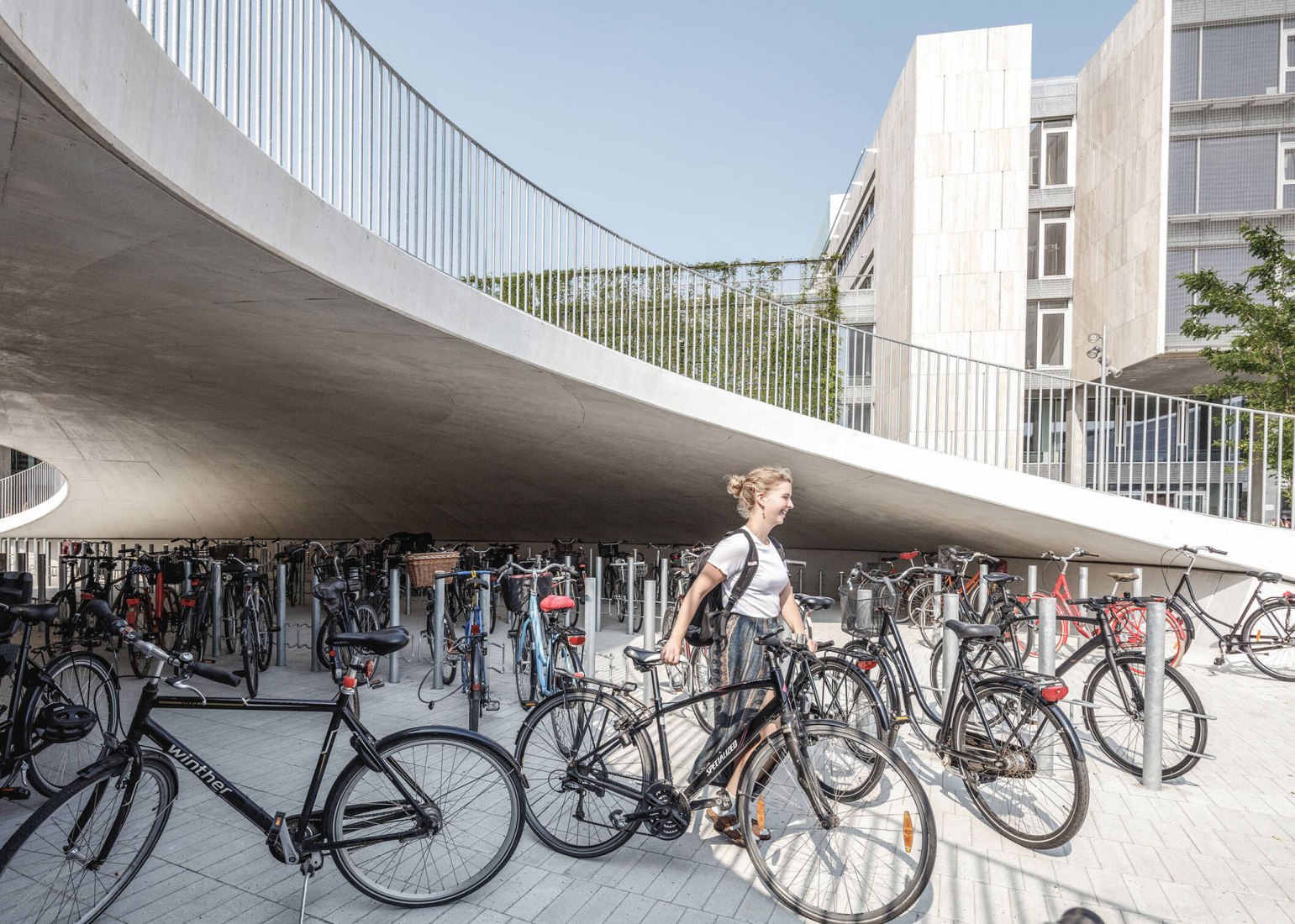 Bicycle parking under the hills. Karen Blixens Plads by COBE The