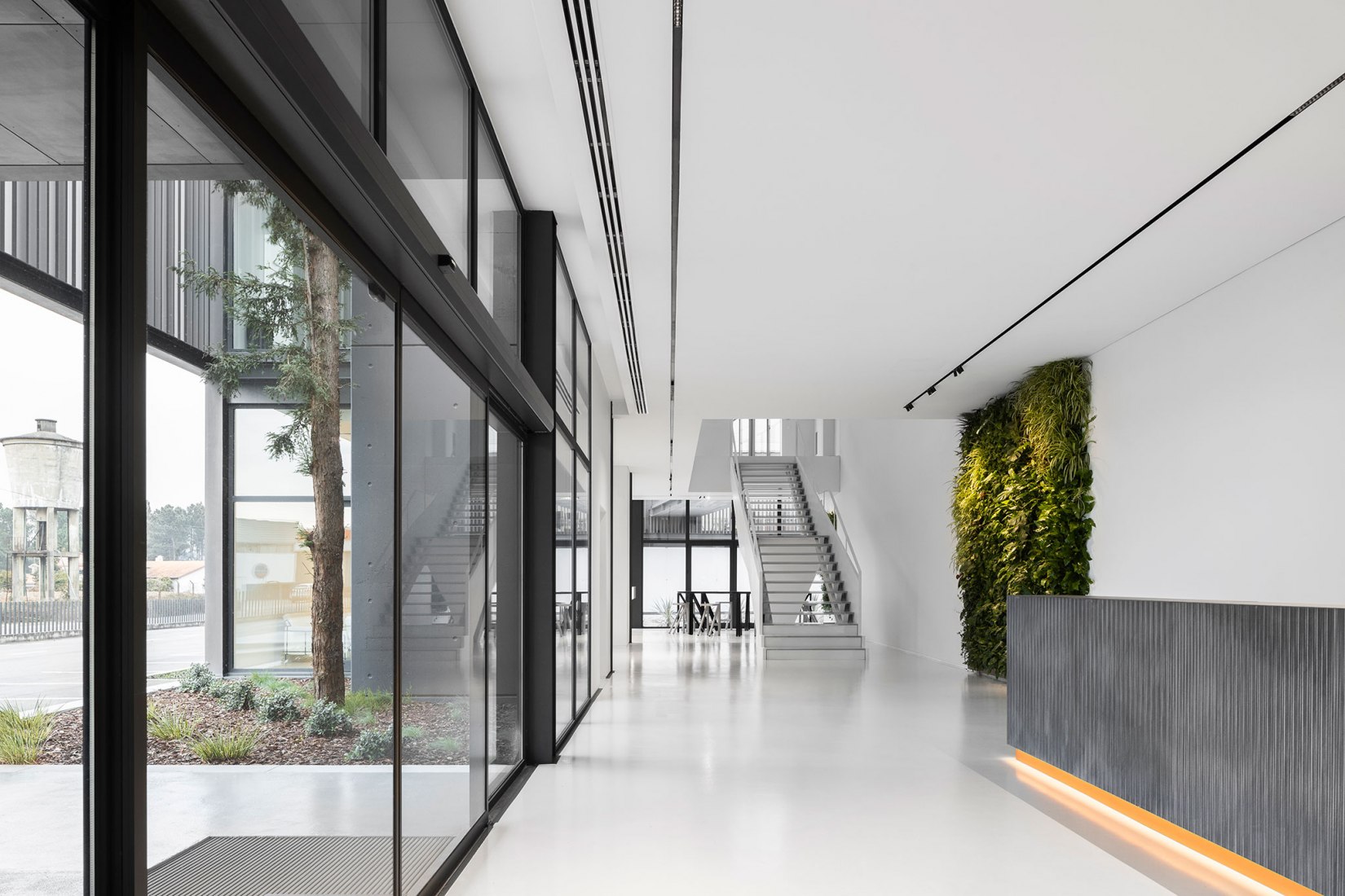 Requalification and expansion of the Ramalhos facilities by Espaço Objecto. Photograph by Ivo Tavares Studio.