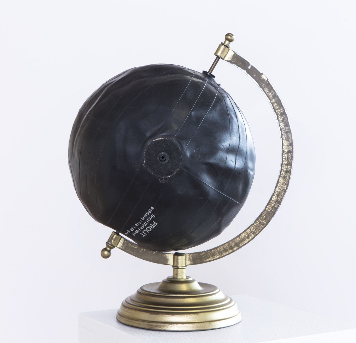 Ronny Quevedo (b. 1981), Errant Globe, 2015. Soccer-ball bladder and globe stand, 11 3/4 x 8 1/4 x 7 1/2 in. (29.8 x 21 x 19.1 cm). Collection of the artist. Photograph by Argenis Apolinario