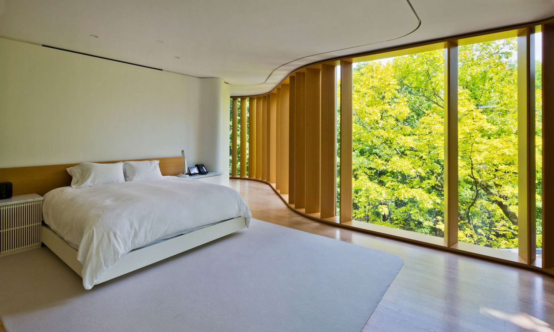 Bedroom of the Integral House by Shim-Sutcliffe Architects for James Stwewart. Photograph © Sotheby's International Realty. Click above to see larger image