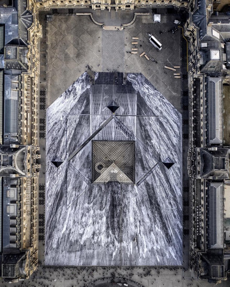 Overview. Artist JR creates a large-scale optical illusion at the Louvre Pyramid, for its 30th birthday