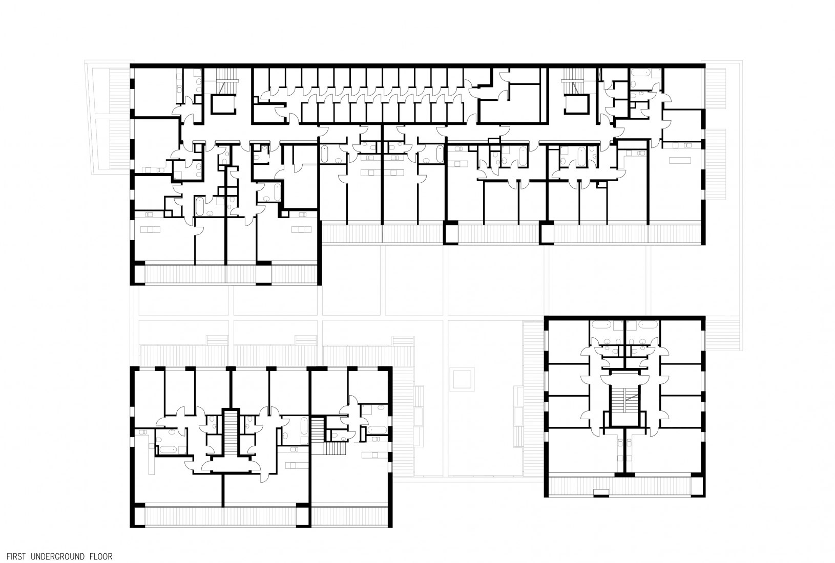 First underground floor plan. Four Houses in One by Kuba & Pilař architekti