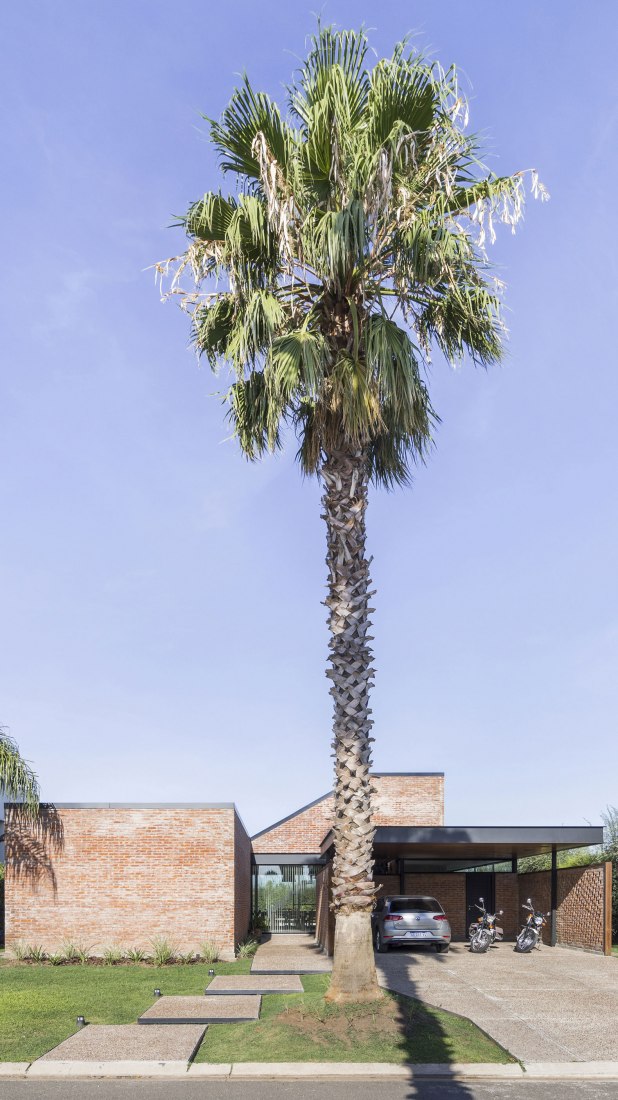 Exterior. House in San Marino, Funes Hills by Mariel Suárez. Photograph by Ramiro Sosa