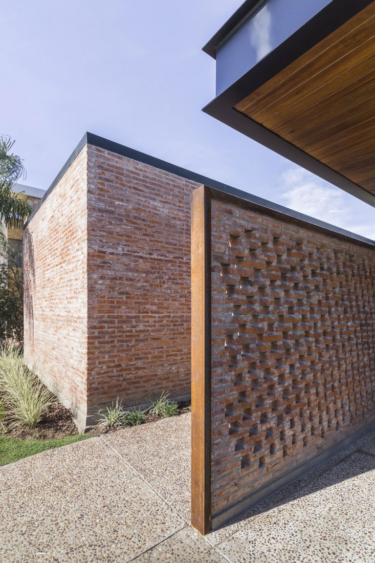 Garage. House in San Marino, Funes Hills by Mariel Suárez. Photograph by Ramiro Sosa