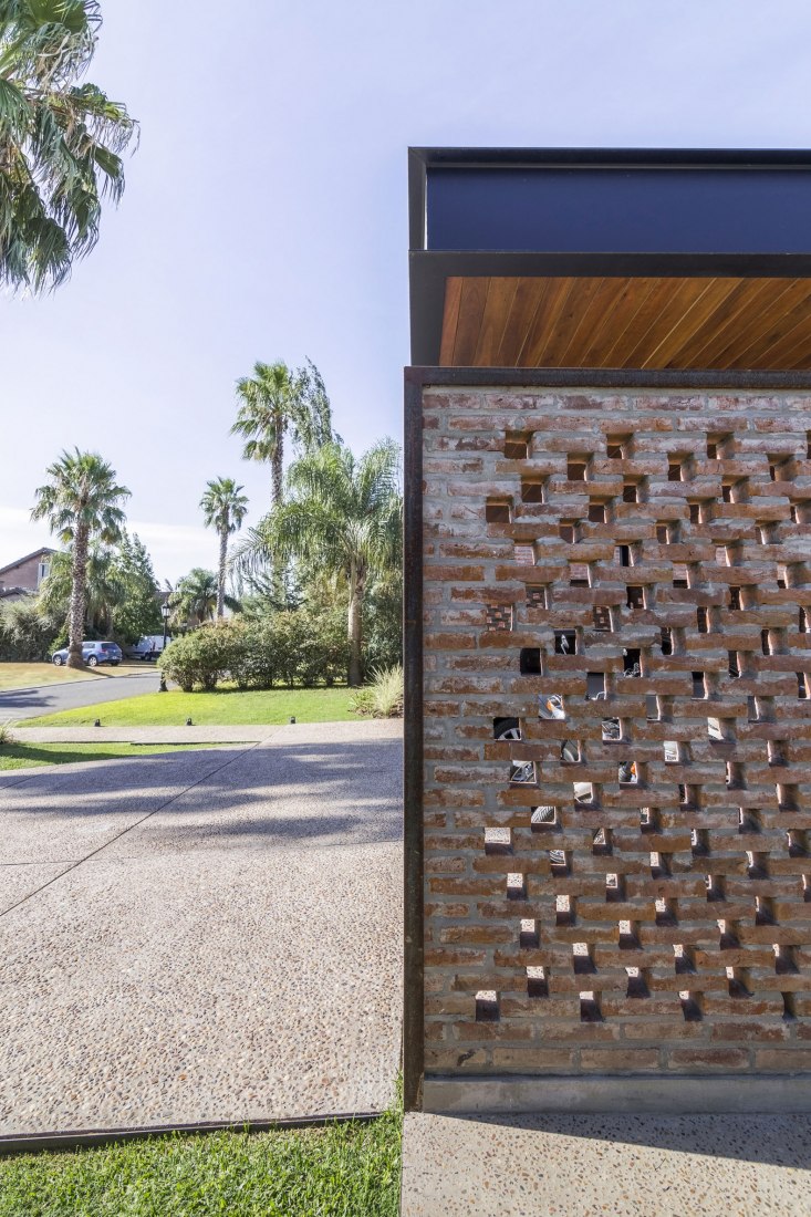 Garage. House in San Marino, Funes Hills by Mariel Suárez. Photograph by Ramiro Sosa