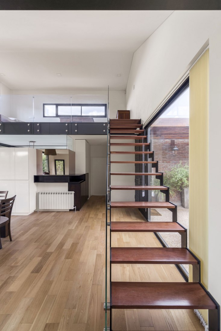 Stairs to the attic. House in San Marino, Funes Hills by Mariel Suárez. Photograph by Ramiro Sosa
