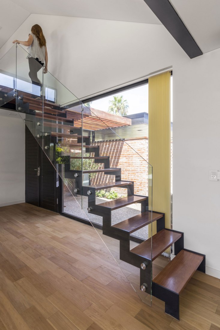 Stairs to the attic. House in San Marino, Funes Hills by Mariel Suárez. Photograph by Ramiro Sosa