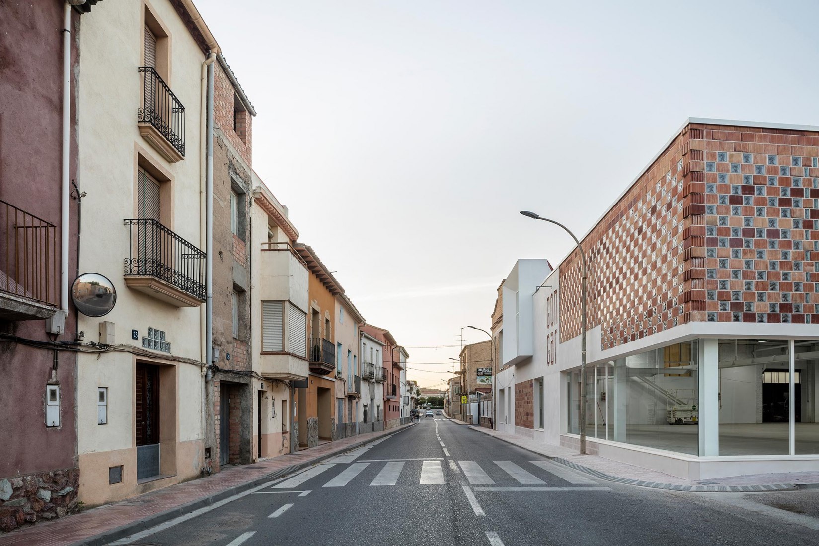 Exterior view. Rehabilitation and expansion of the Gon-Gar Workshops by NUA arquitectures. Photograph © Adriá Goula