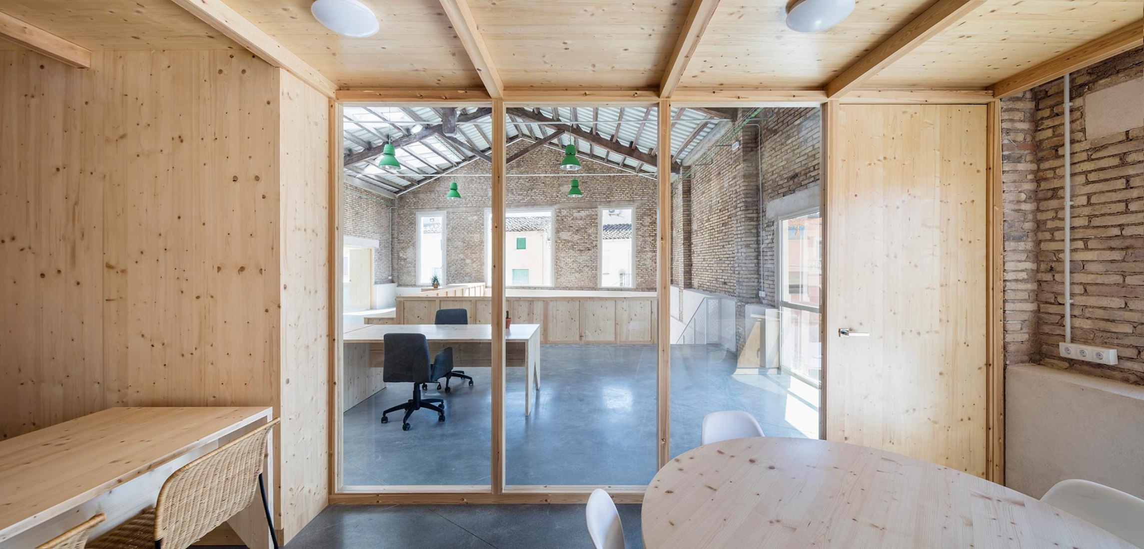 Interior view, Old warehouse. Rehabilitation and expansion of the Gon-Gar Workshops by NUA arquitectures. Photograph © Adriá Goula