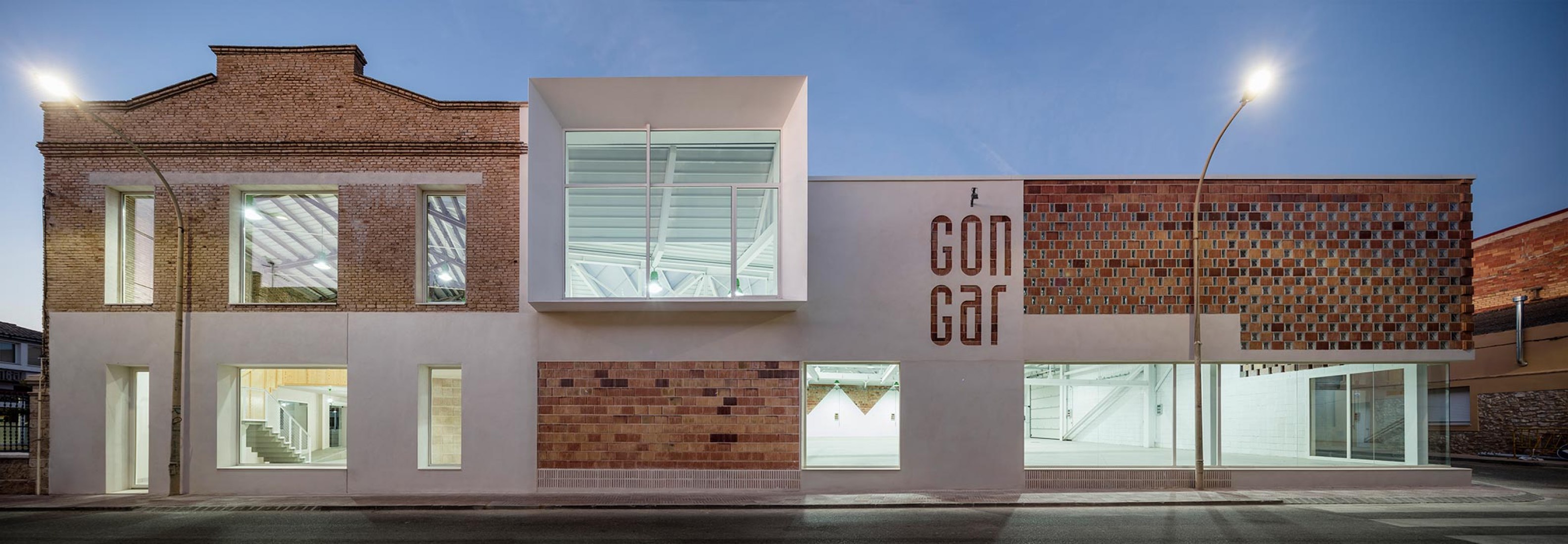 Nightview. Rehabilitation and expansion of the Gon-Gar Workshops by NUA arquitectures. Photograph © Adriá Goula