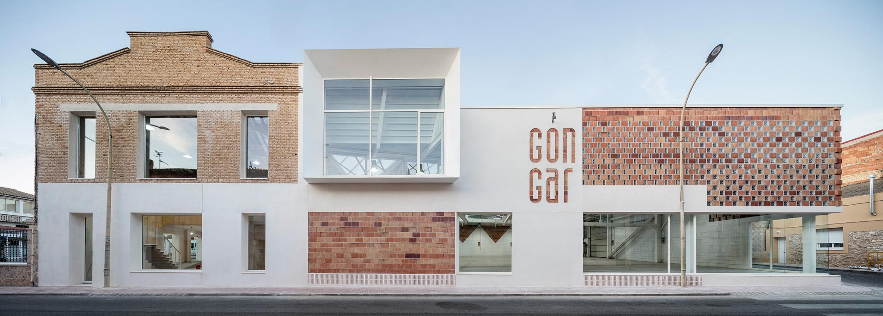 Exterior view. Rehabilitation and expansion of the Gon-Gar Workshops by NUA arquitectures. Photograph © Adriá Goula