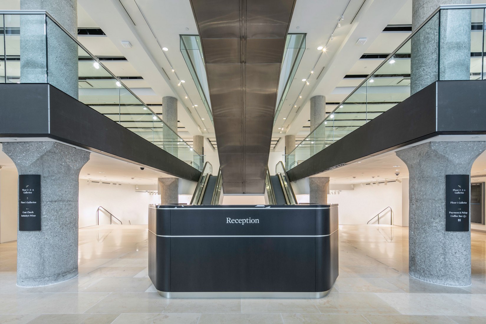 Sotheby's Ground Floor Gallery, reception. Double-height – ceiling over 20 feet tall. Sotheby’s NY by OMA, photograph by Brett Beyer Photography.