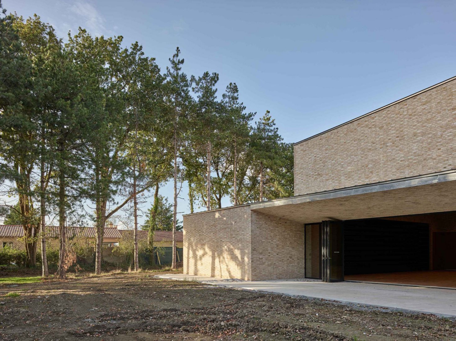 Façade. Pierres Blanches Cultural center by RAUM architects. Photograph by Stephane Chalmeau