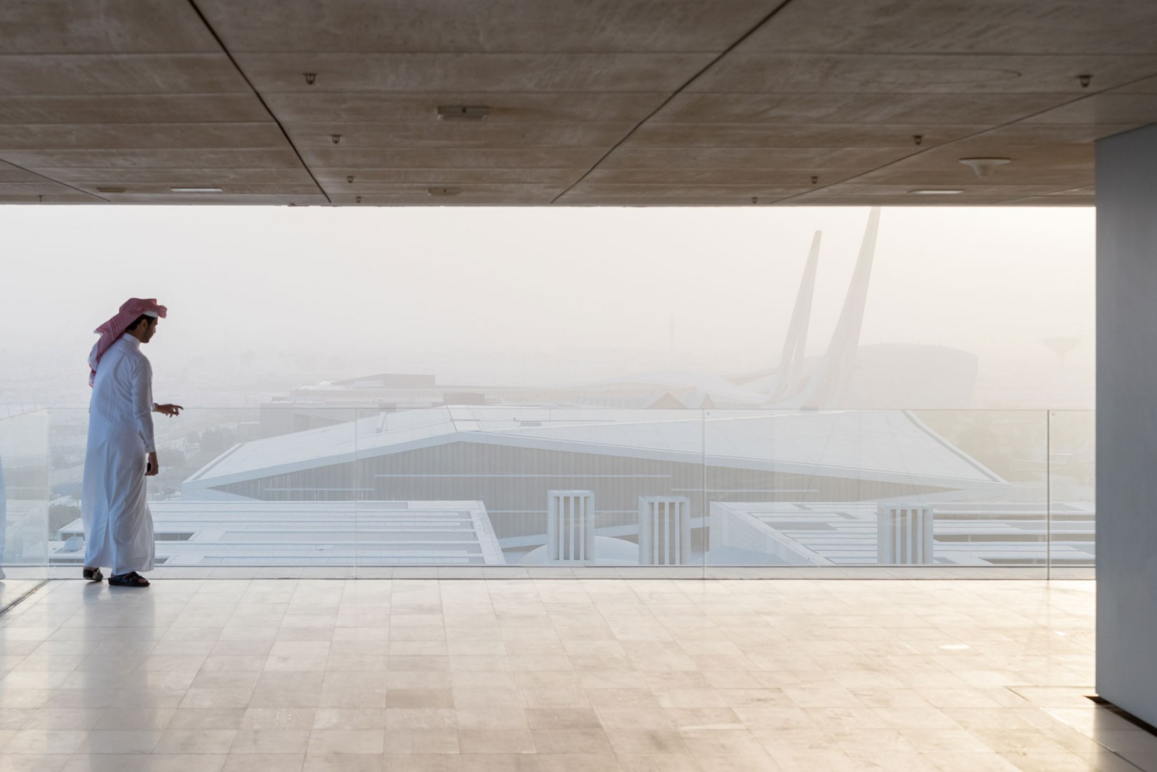 Exterior view from another building. Qatar National Library by OMA. Photograph by Iwan Baan, Courtesy of OMA