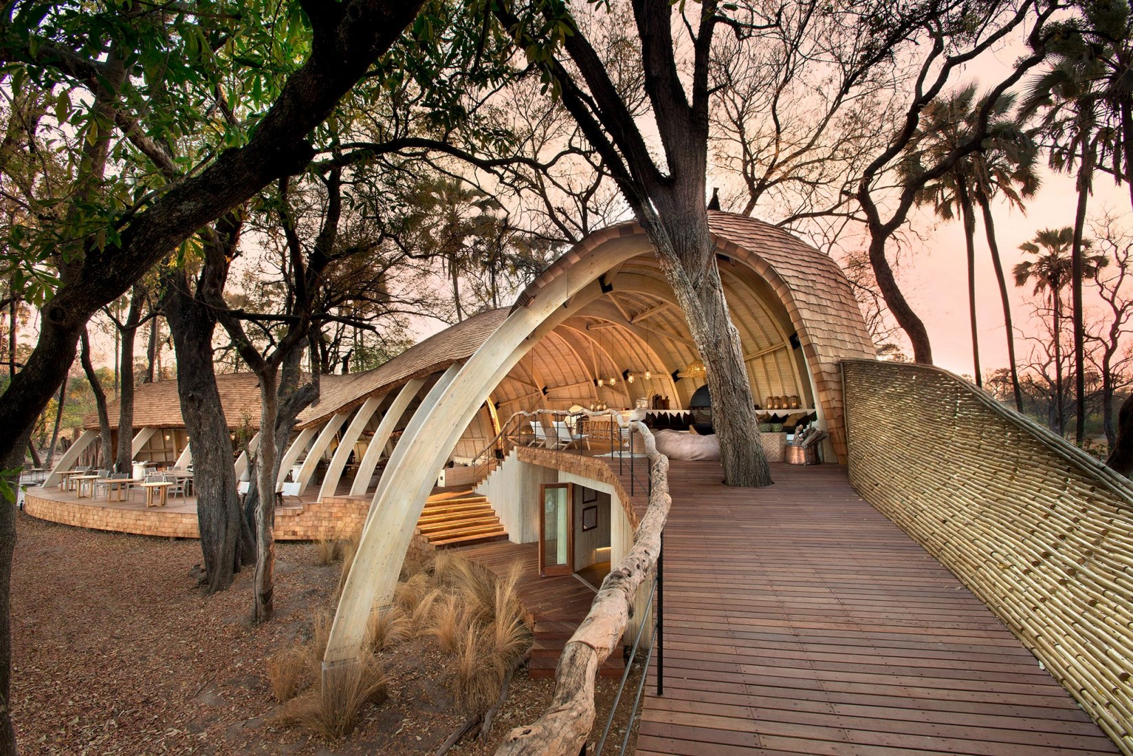 Exterior view of the lodge of the Sandibe Okavango Safari in Botswana, by Nicholas Plewman Architects and Michaelis Boyd Architects. Photography © Dook. Click above to see larger image.