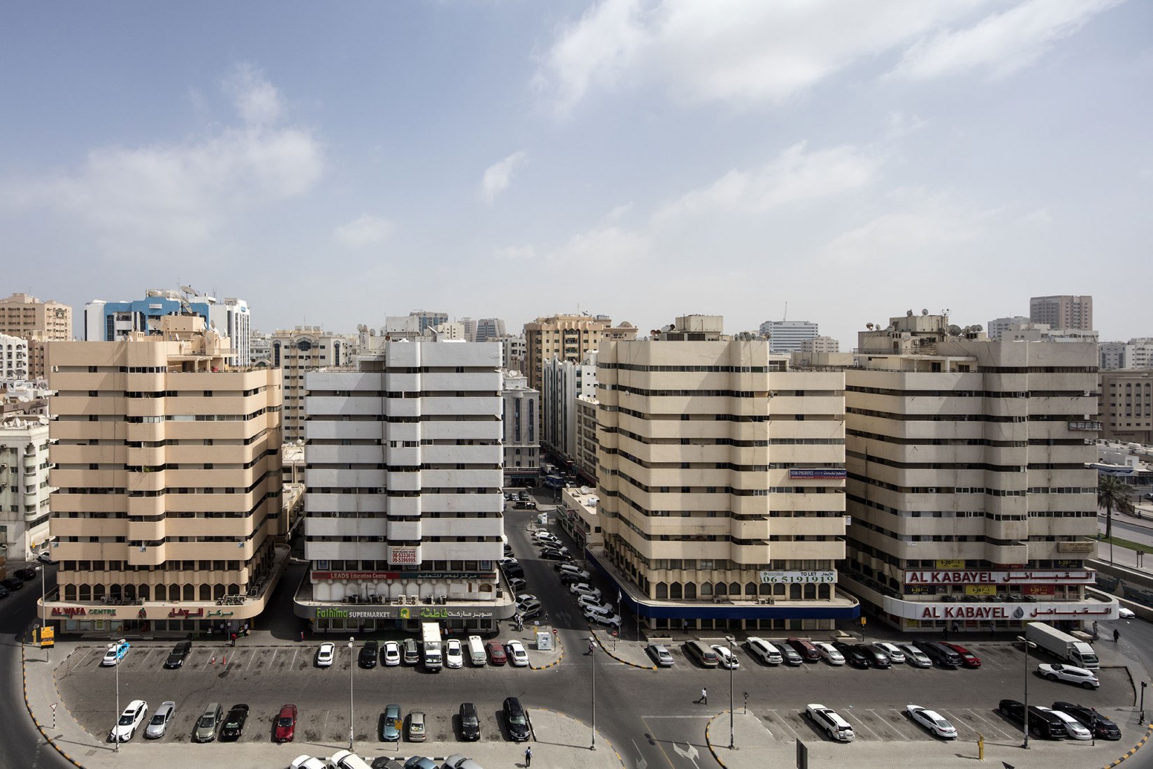 Northwest view of Bank Street buildings, Bank Street, Sharjah, Architects Tecnica y Proyectos (TYPSA), 1977. Sharjah Architecture Triennial: the first international platform on architecture in the MENASA region. Photograph by Ieva Saudargaite