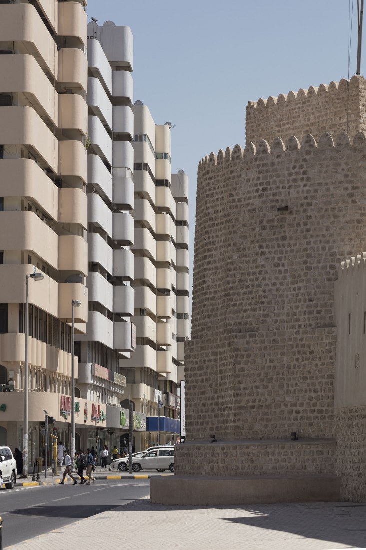 Street view of Bank Street buildings and Al Hisn Fort Museum, Sharjah. Sharjah Architecture Triennial: the first international platform on architecture in the MENASA region. Photograph by Paul Gorra