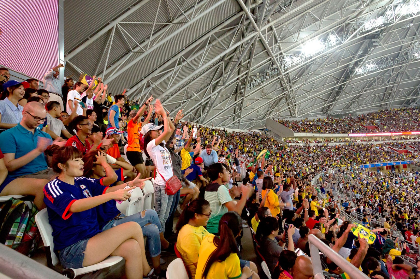 Cheering crowd. Singapore National Stadium by ARUP Associates. Image © Arup Associates.