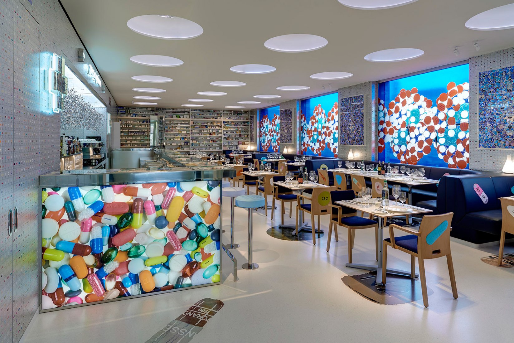 The restaurant's interior is flamboyantly decorated with Hirst's signature pill patterns. Newport Street Gallery, Caru-so St John Architects © 2016 Pharmacy 2