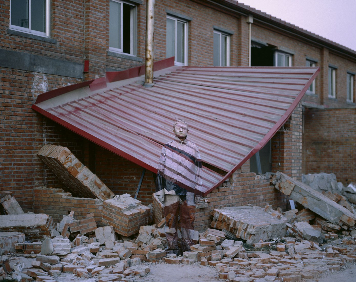 SuojiaVillage, Beijing, 2005. The invisible man, Liu Bolin, in the palace of Gaviria.  CourtesyBoxart, Verona.