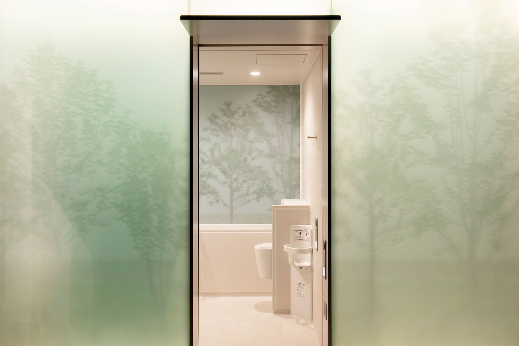 The fully accessible “everyone’s toilet” is equipped with a baby chair and ostomate facilities. Andon Toilet. Toilet in Nishihara Itchome Park by Takenosuke Sakakura. Photograph by Satoshi Nagare, courtesy of the Nippon Foundation