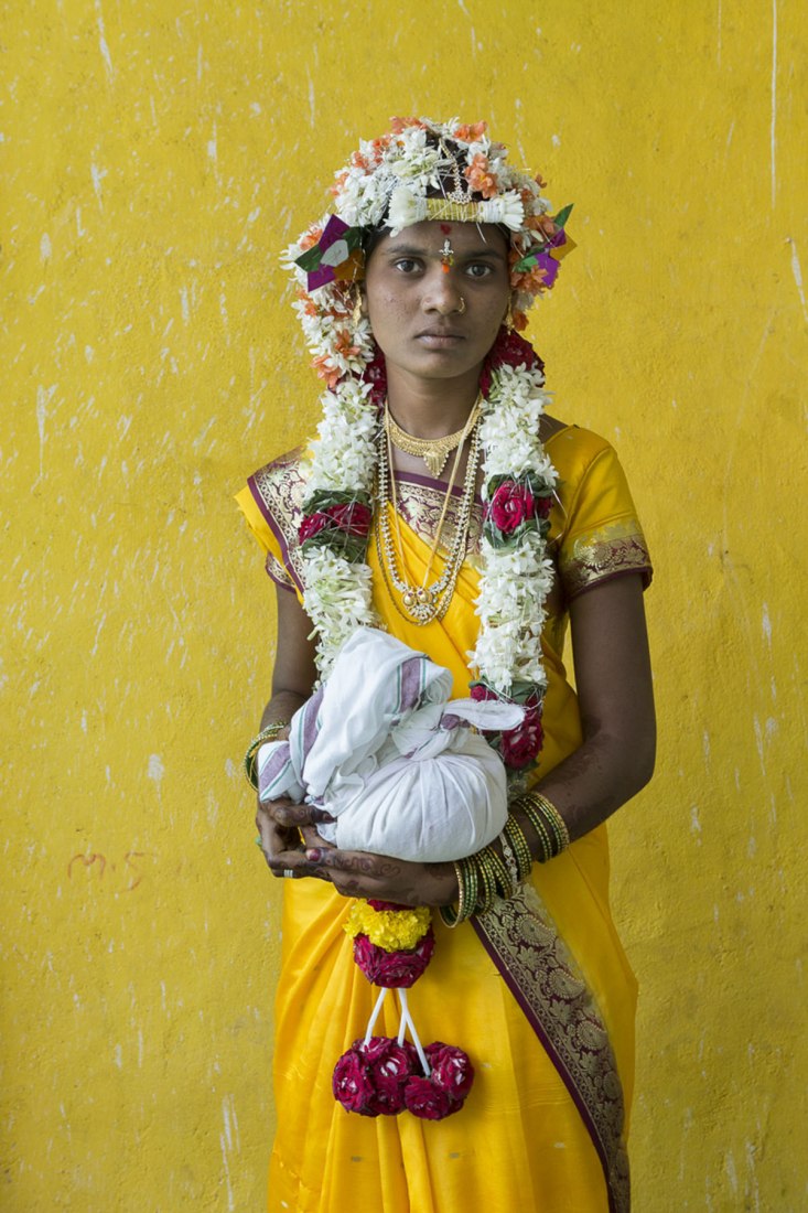 Shirvani on the day of their wedding. She holds a sack full of rice to offer to the groom's family and symbolizes confidence that the new family will not lack food. Tierra de sueños. Photograph © Cristina García Rodero. Courtesy of Fundación la Caixa Madrid
