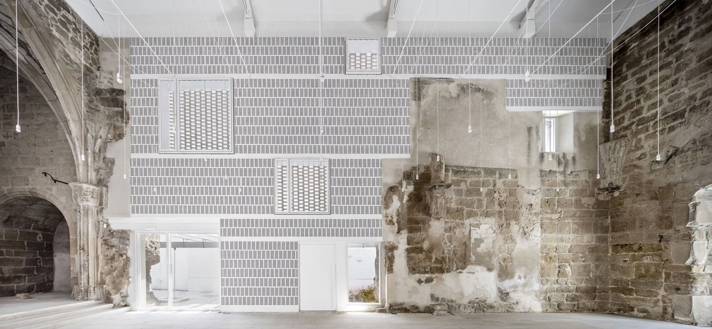 Rehabilitation of the The Ancient Church of Vilanova de la Barca by AO. Photography © Adrià Goula