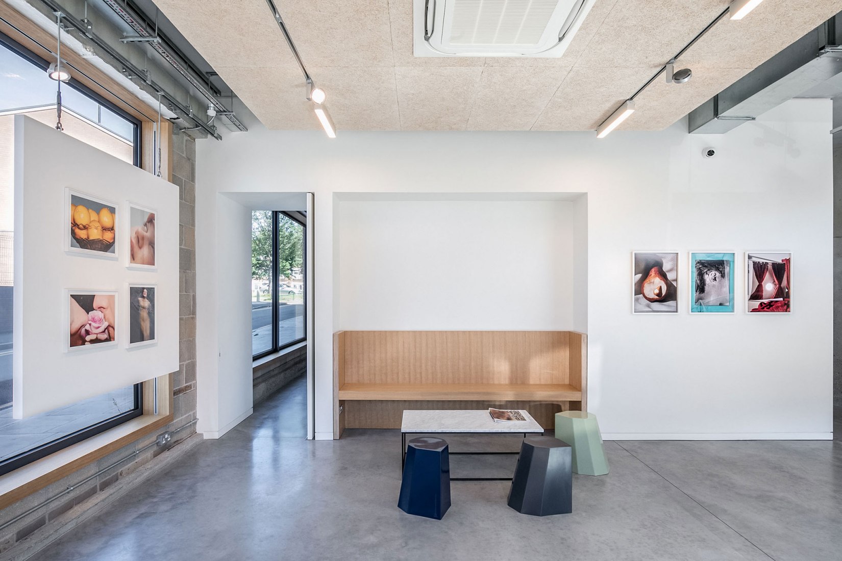 Entrance and Creative Meeting Space with bench and door to small office. Creative Agency Dalston-N16 by VOSS Architects. Photograph by Taran Wilkhu Photography