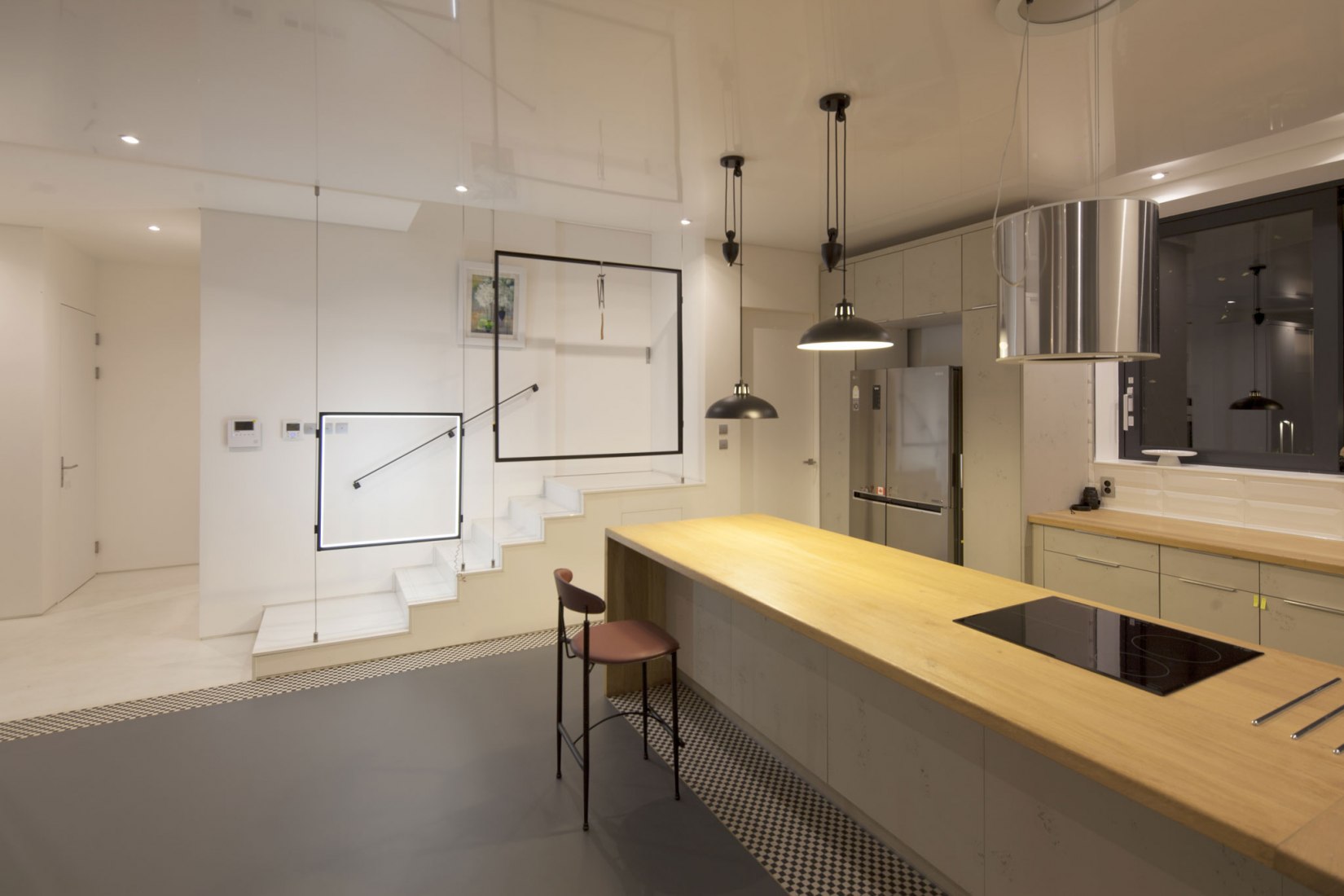 Kitchen. House [in white] by AEV Architectures. Photograph by Hyunjune Lee