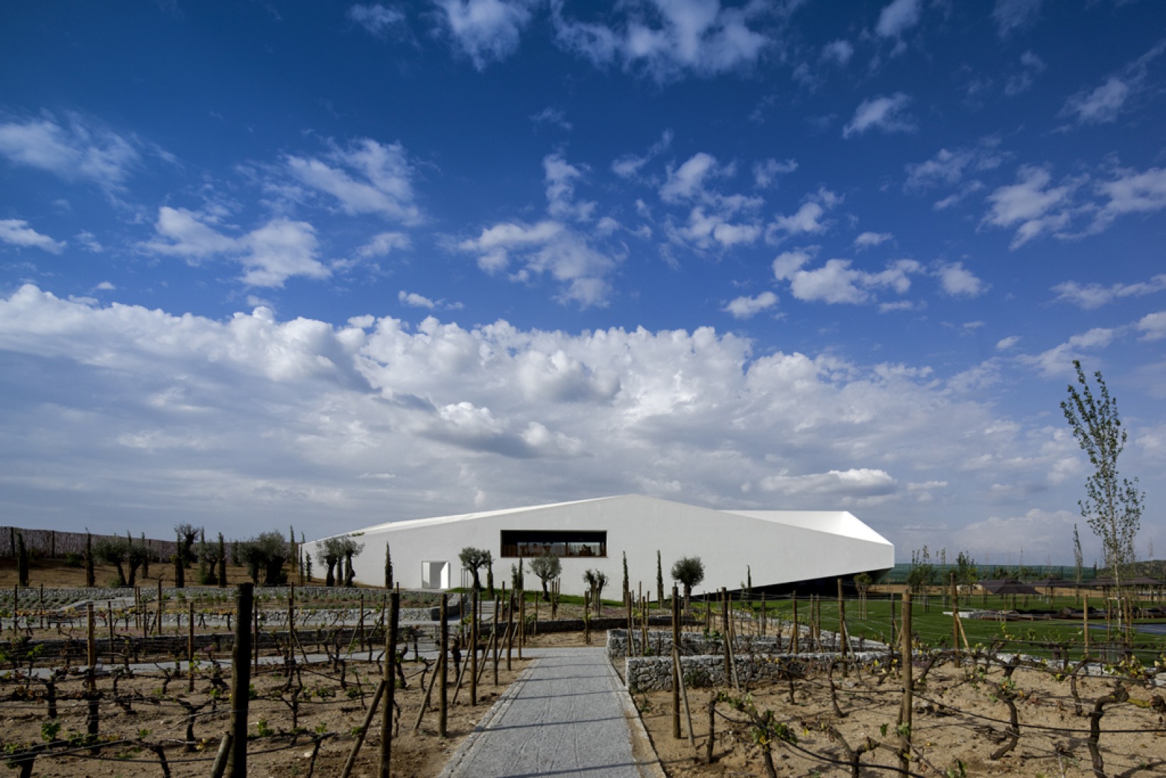 Night view of Hotel reception and spa, L’And Vineyards Hotel by PROMONTORIO.   Photography © Fernando Guerra | FG+SG.