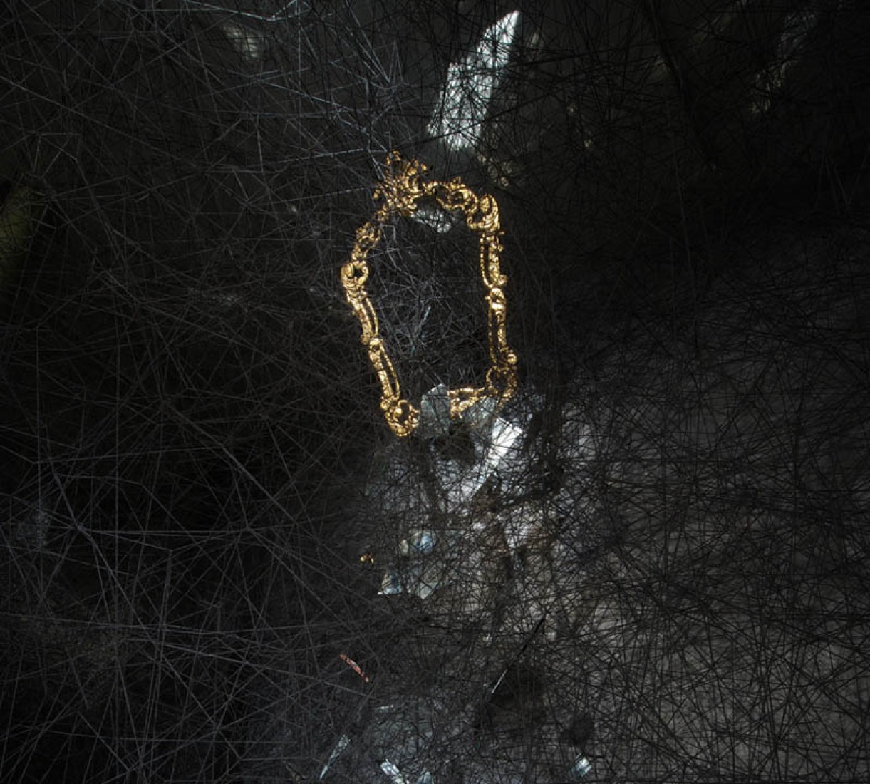 "Reflection of the past." Black wool, mirror. "Synchronizing Strings and Rhizomes " by Chiharu Shiota. Photography © Sunhi Mang