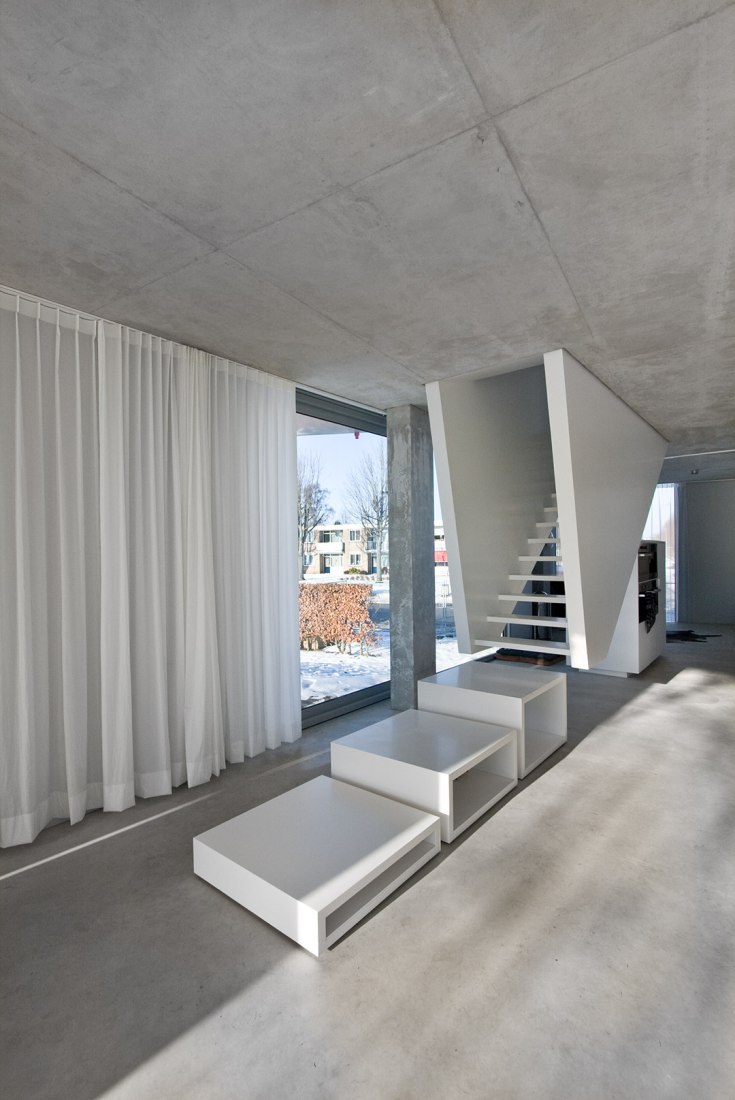 Interior view of H House, sculptural staircase. Photography © Joao Morgado.