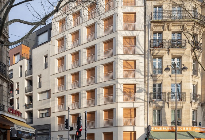 15 housing units in solid stone, timber and hemp concrete by MAO Architectes. Photograph by Cyrille Lallement.