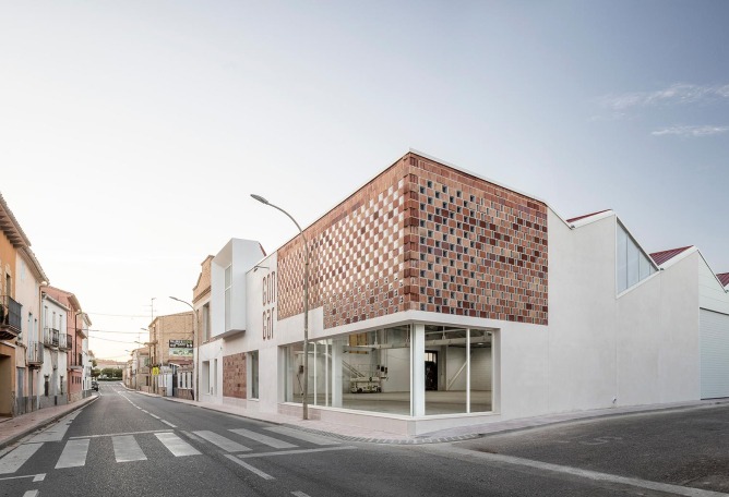 Exterior view. Rehabilitation and expansion of the Gon-Gar Workshops by NUA arquitectures. Photograph © Adriá Goula
