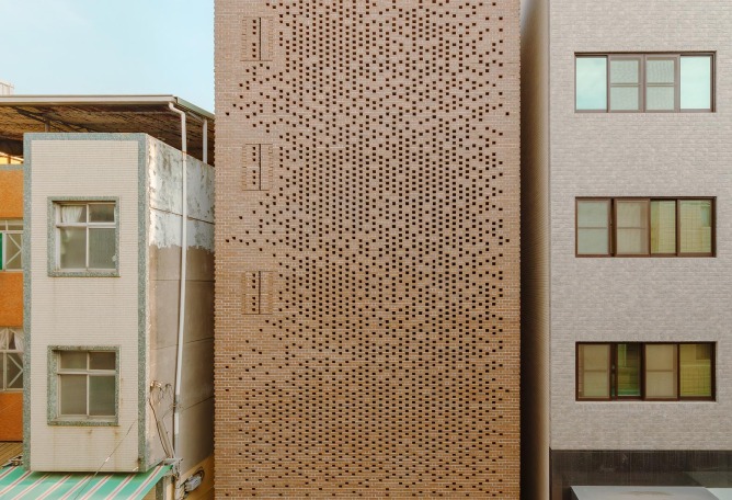 The Veil House by Paperfarm: a compact life enveloped by a brick