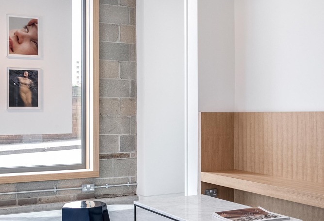 Entrance and Creative Meeting Space with bench and boards to western windows. Creative Agency Dalston-N16 by VOSS Architects. Photograph by Taran Wilkhu Photography